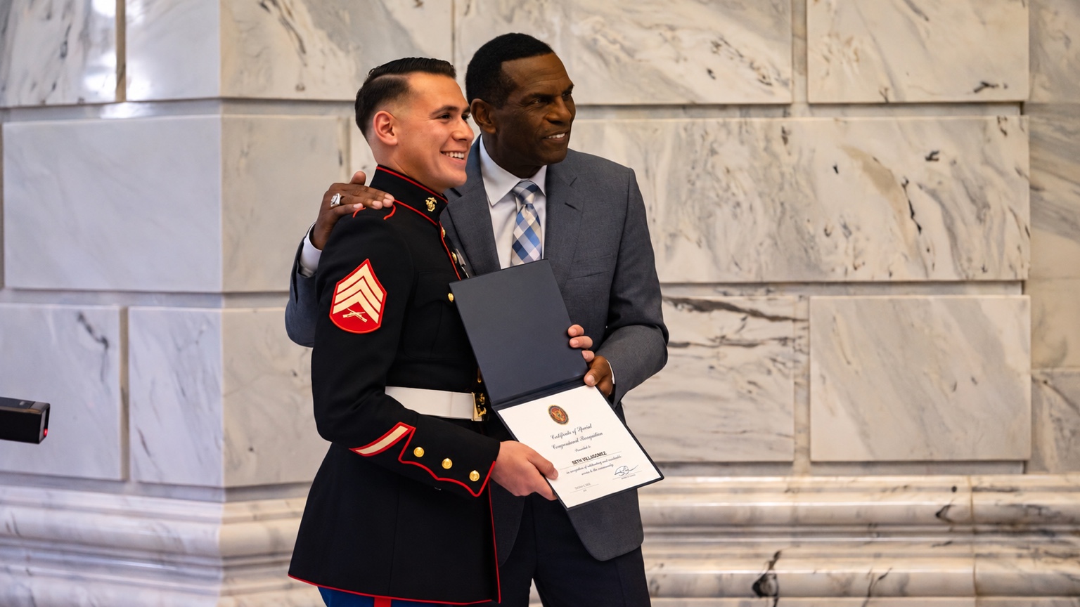 Seth A. Villagomez receiving a Certificate of Special Congressional Recognition from U.S. Representative Burgess Owens