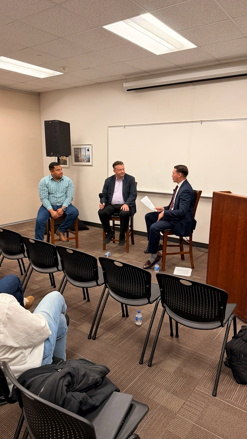 Audience view of Councilman Carlos Moreno, Senator Todd Weiler, and Seth A. Villagomez at the inaugural Utah Emerging Leaders Forum